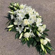 All white rose and Lilly casket Spray