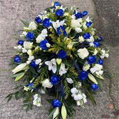 Blue and white casket spray